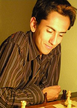 GM Mauricio Flores Rios over a chess board