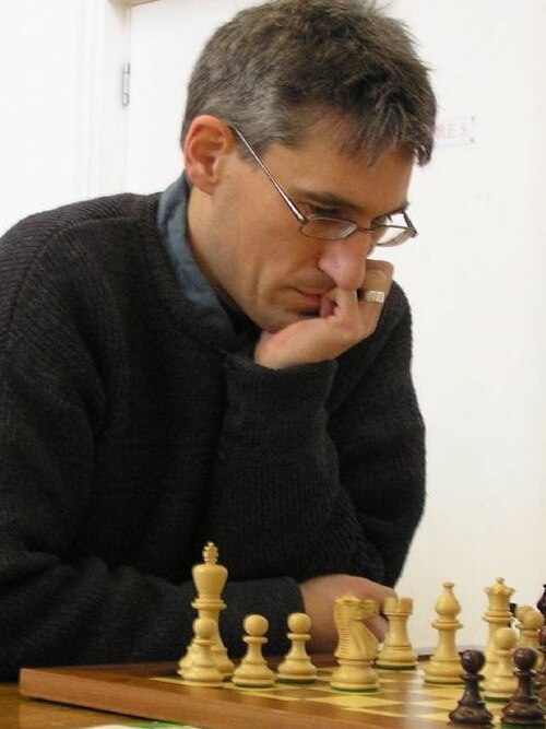 GM Daniel King playing a chess game.